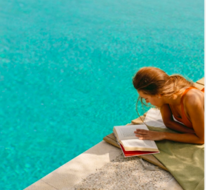Leave your Kindle or tablet at home - because the book is back on holiday