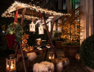 THE TERRACE OF THE CHARLES HOTEL HAS BEEN TRANSFORMED INTO A COSY WINTER VILLAGE
