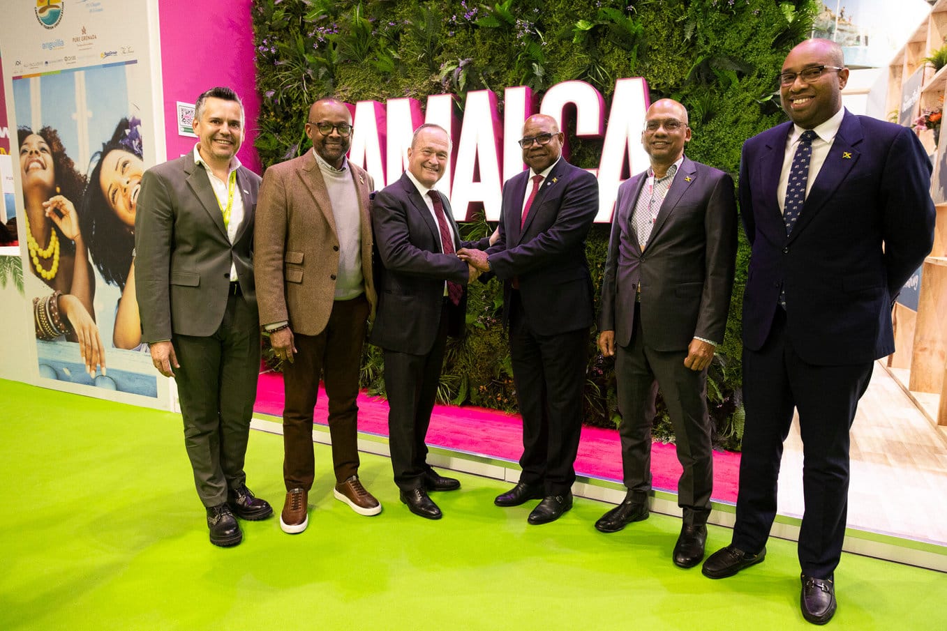 (HM World2Fly) Minister of Tourism, Hon. Edmund Bartlett (3rd L) shakes hands with Mark Nueschen, World2Meet’s (W2M) International Business Manager, at the Jamaica booth at World Travel Market (WTM) London yesterday. Others are (L-R) Juan Romaguera, Head of Partnership Marketing, World2Meet;  Donovan White, Director of Tourism, Jamaica Tourist Board (JTB); Gregory Shervington, JTB’s Regional Director for Continental Europe and Delano Seiveright, Advisor and Senior Communications Strategist, Ministry of Tourism. This follows the announcement of a new flight from Portugal to Montego Bay with Spanish airline World2Fly. 