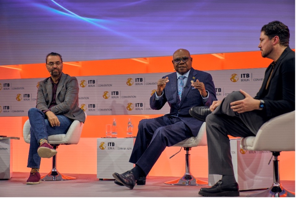 Minister of Tourism, Hon Edmund Bartlett (c) makes his presentation during a panel discussion on ‘The Understanding: Polycrisis in Travel’ at ITB, Berlin on Tuesday March 3, 2026. Seen also are L-R panellists, Aziz Abu Sarah, Co-Founder bei ME JDI Tours and Stephen Dutton, Global Insight Manager, Travel bei Euromonitor International.