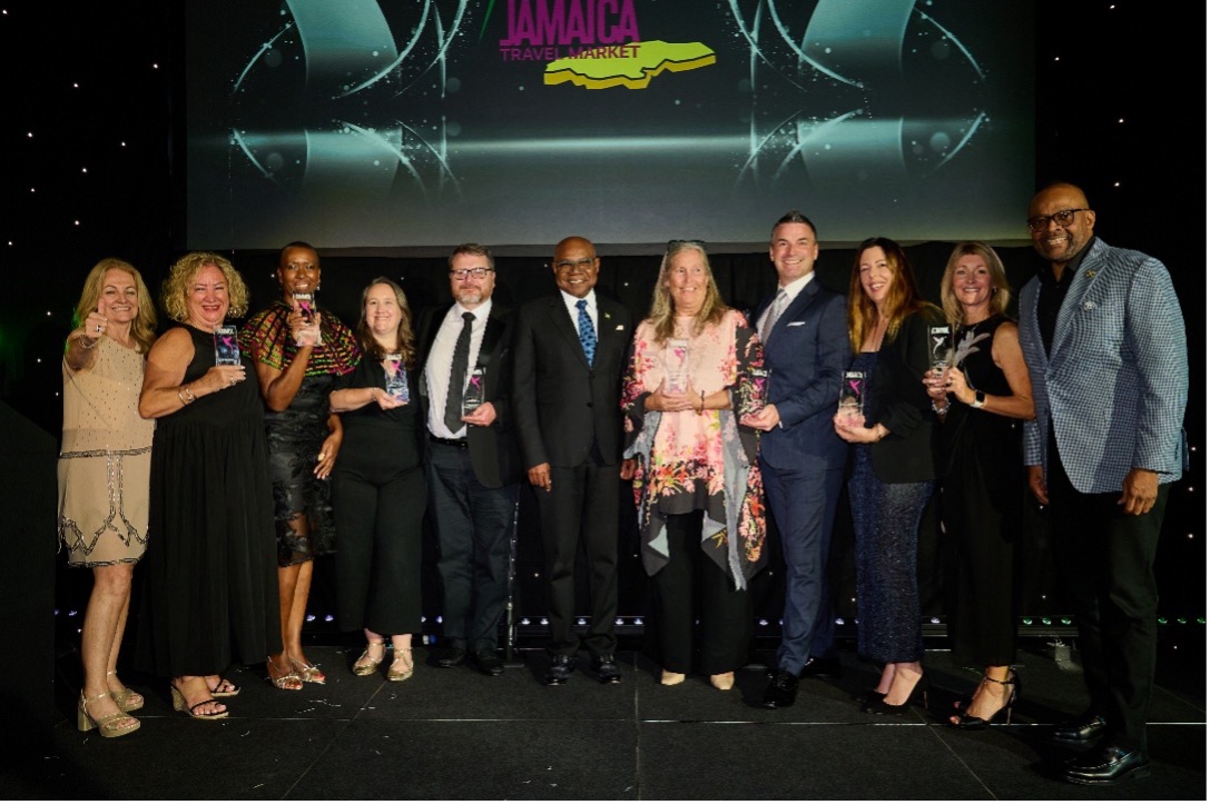 Minister of Tourism, Hon Edmund Bartlett (C) is flanked by L-R, Elizabeth Fox, Regional Director, UK, Top UK tour operators who were recognized for their contribution to selling the destination and Donovan White, Director of Tourism, at the Platinum Celebration Awards held at the Ashdown Park Hotel on Thursday October 2, 2025.
